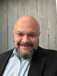 man smiling wearing a suit